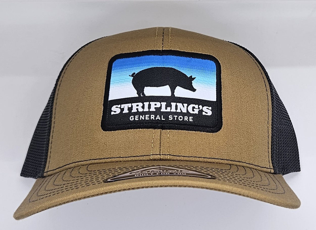 Stripling's khaki trucker hat with black mesh and a square pig patch on the front