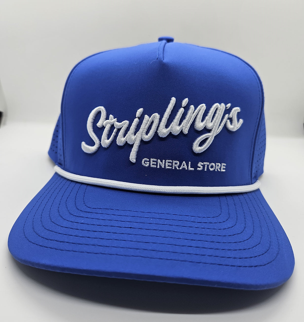Angled view of the Stripling's royal blue rope hat showing the vented side panels
