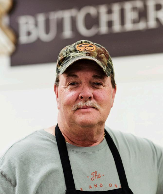 A butcher at the counter in Stripling's General Store