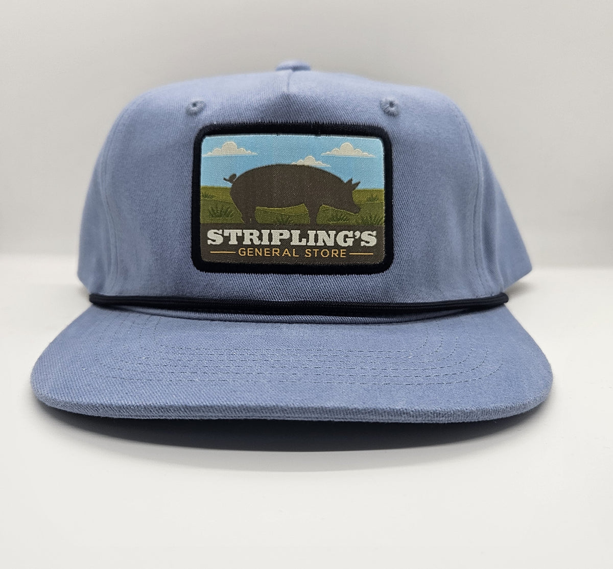 Stripling's washed blue rope hat with a black rope and the scenic pig patch