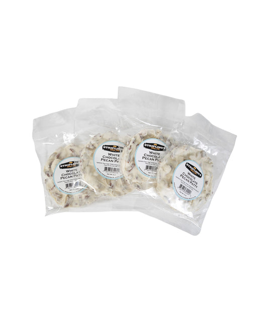 Four Stripling's white chocolate pecan patties in clear bags, fanned out