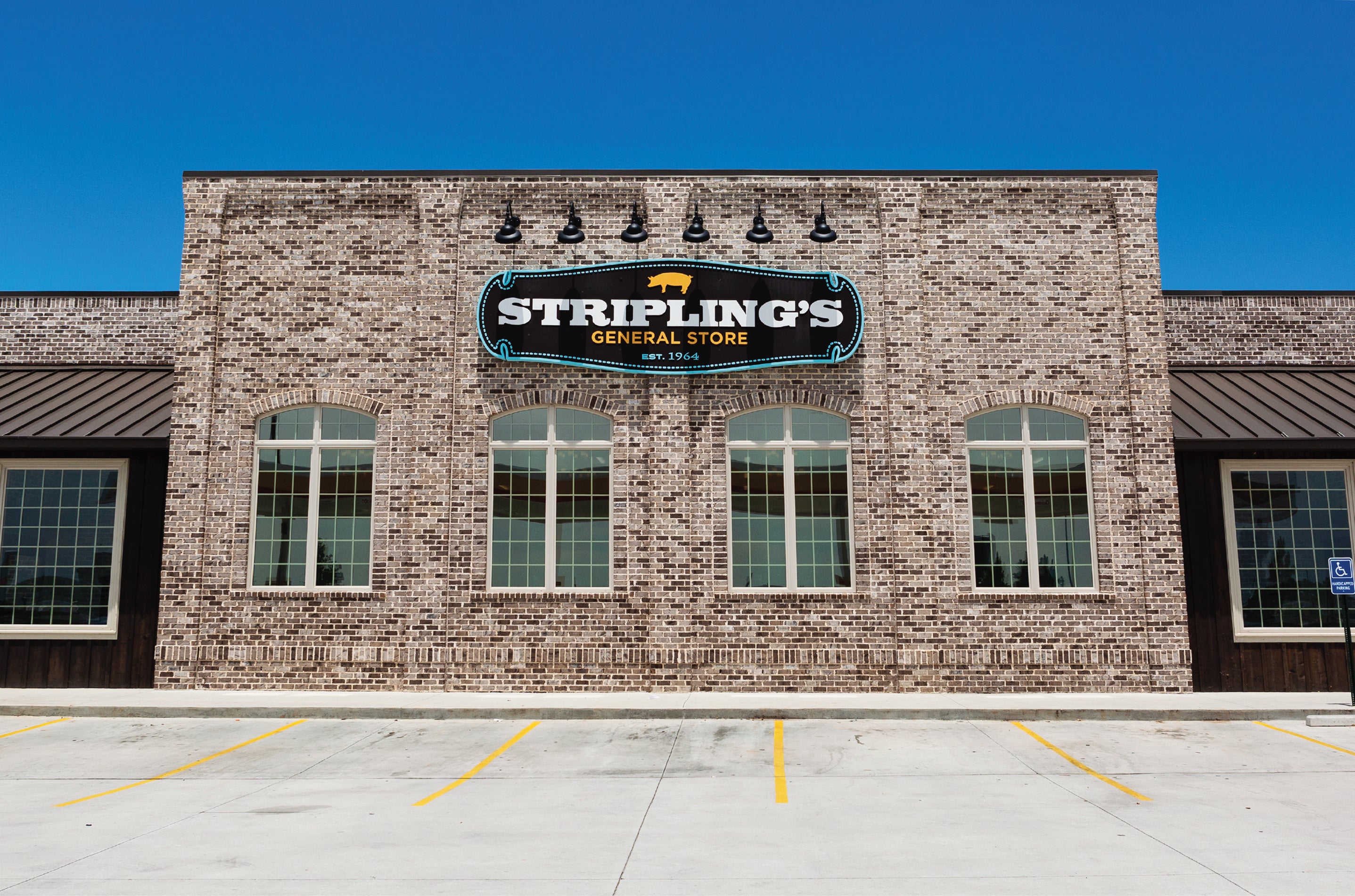 Striplings General Store storefront brick building with sign